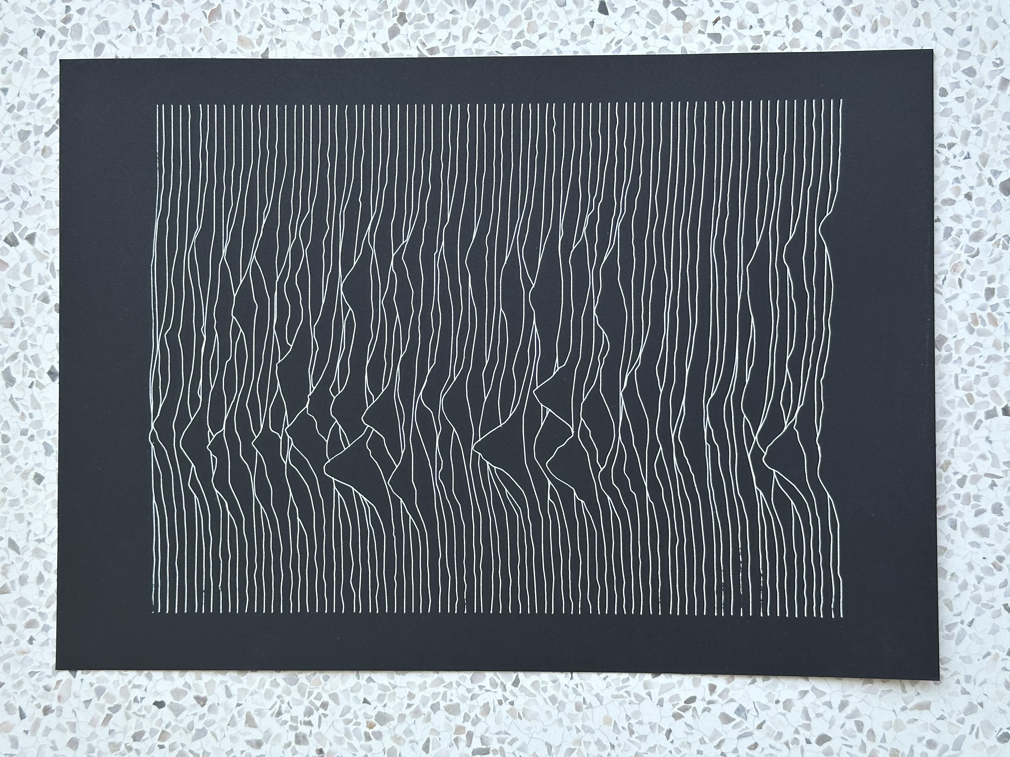 Unknown Pleasures pen plot on black paper, top view